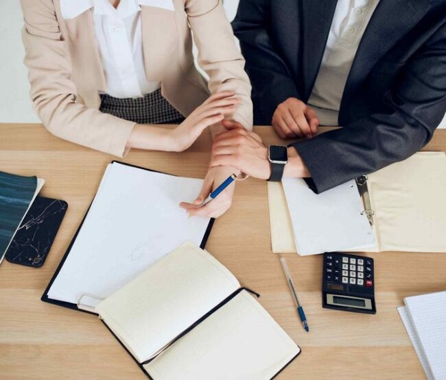 Parents reviewing financial documents for California child support calculation.