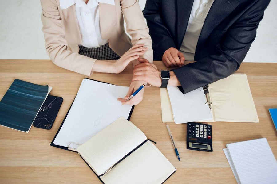Parents reviewing financial documents for California child support calculation.
