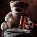 Visual representation of when child support ends in California with gavel and money.